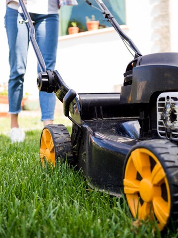 woman-mowing-yard